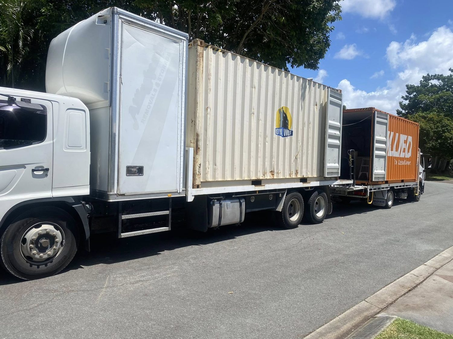 Jacaranda truck transporting a loaded shipping container