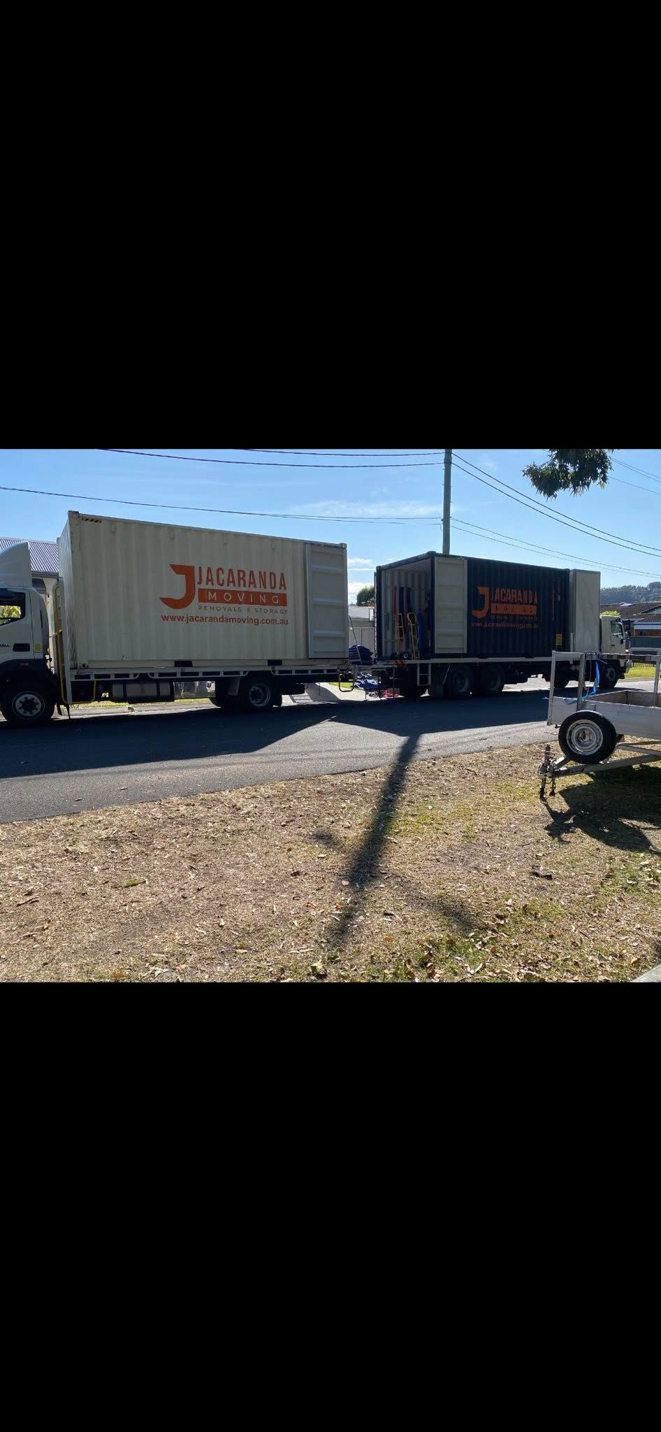 Two Jacaranda container trucks ready for collections and deliveries